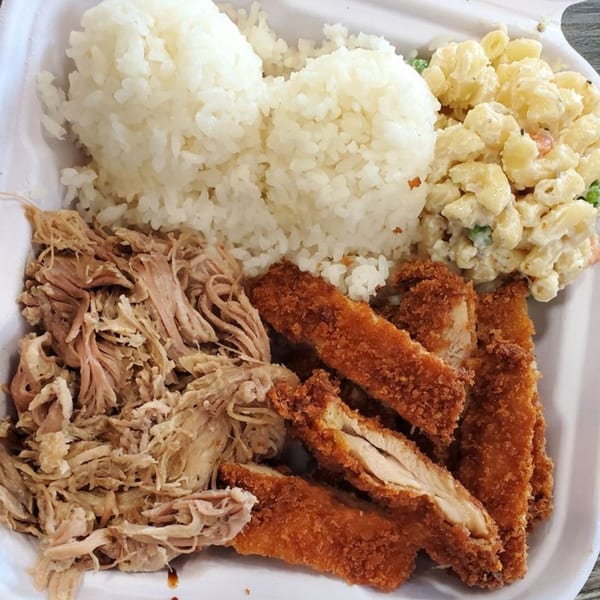A Hungry Hawaiian plate lunch with kalua pig, chicken katsu, white rice, and macaroni salad.