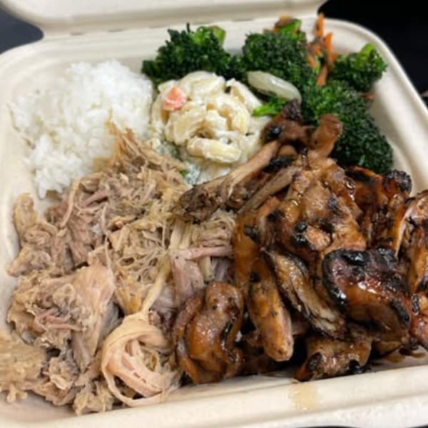 A Hungry Hawaiian plate lunch with kalua pig, grilled chicken, rice, macaroni salad, and broccoli.